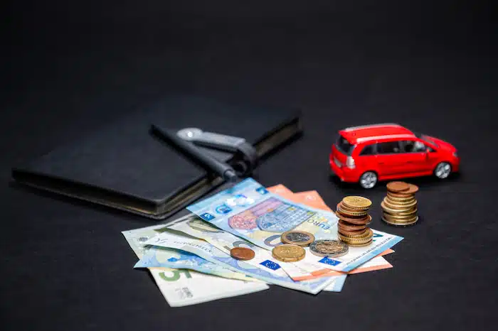 money, car and a notebook: calculating Business Vehicle Expenses for tax deductions