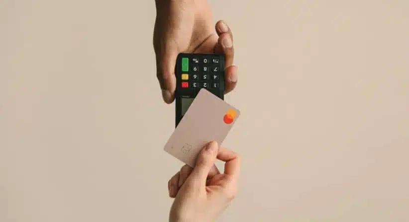 close up picture of a business credit card that are being used in transaction