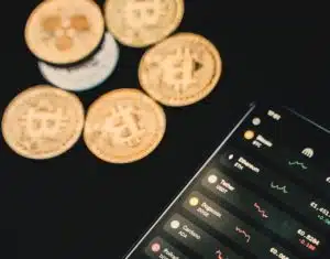 gold coin points aside with smartphone
