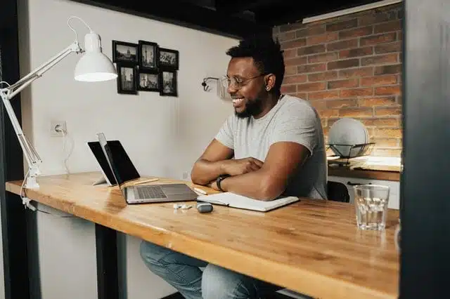 Business owner paying himself on his computer